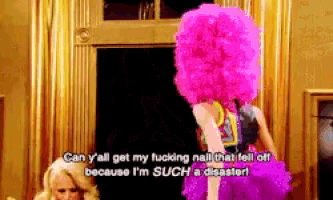 a woman in a pink wig says can y all get my fucking nail that fell off
