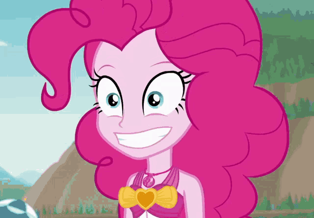 pinkie pie from my little pony is smiling and wearing a heart shaped necklace