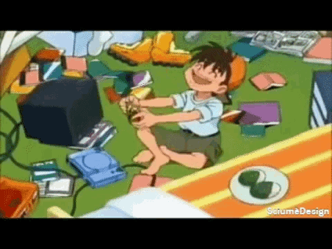 a boy sitting on the floor playing a video game