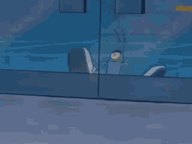a cartoon character from spongebob squarepants is standing on top of a shoe .