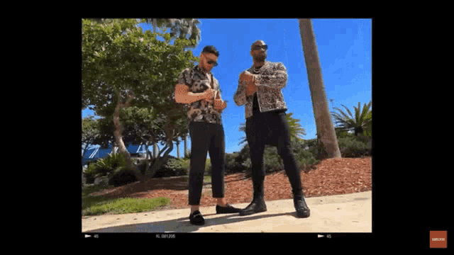 two men are standing next to each other on a sidewalk with a watermark that says ' unanswerable ' on the bottom