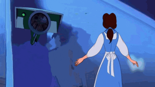 a woman in a blue dress stands in front of a security camera