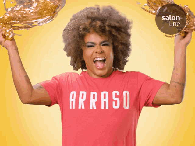 a woman wearing a red t-shirt that says arraso