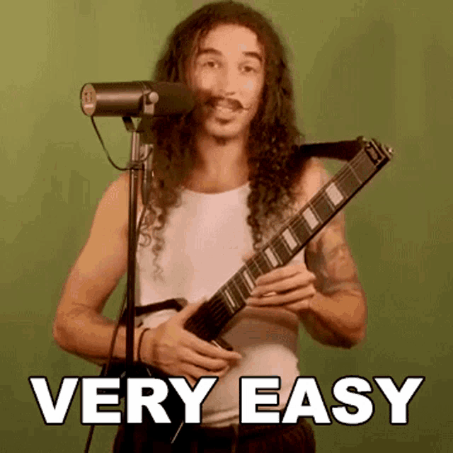 a man with long curly hair is playing a guitar and singing into a microphone with the words very easy above him