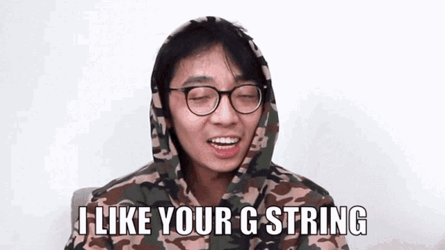 a man wearing glasses and a camouflage hoodie says i like your g string