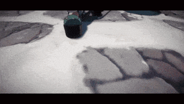a black box is sitting on a snowy ground