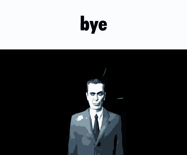 a man in a suit and tie is standing in a dark room .