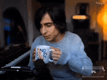 a man is holding a mug that says find joy in each on it
