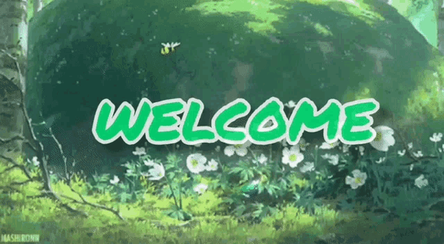 a green welcome sign is surrounded by flowers and trees