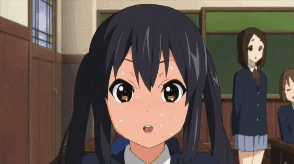 a girl with two pigtails is standing in a classroom