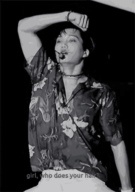 a black and white photo of a man with the words " girl who does your hair " below him