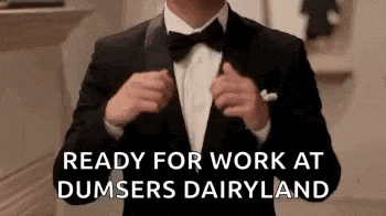 a man in a tuxedo and bow tie is getting ready to work at dairyland .