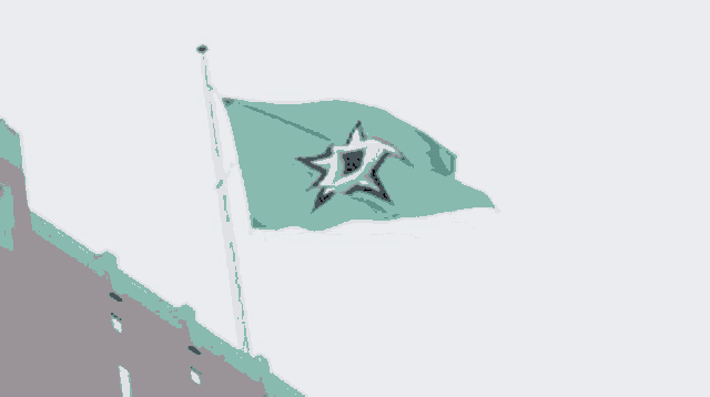 a green flag with a seagull on it is waving in the wind