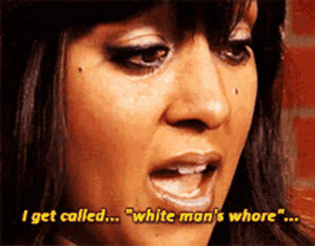 a close up of a woman 's face with the words " i get called white man 's whore "
