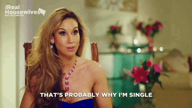 a woman sitting in a chair with the words that 's probably why i 'm single