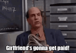 a bald man is holding a pair of shoes and saying `` girlfriend 's gonna get paid '' .
