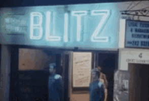a neon sign for blitz is lit up in the dark