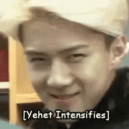 a close up of a man 's face with the words yehet intensifies .