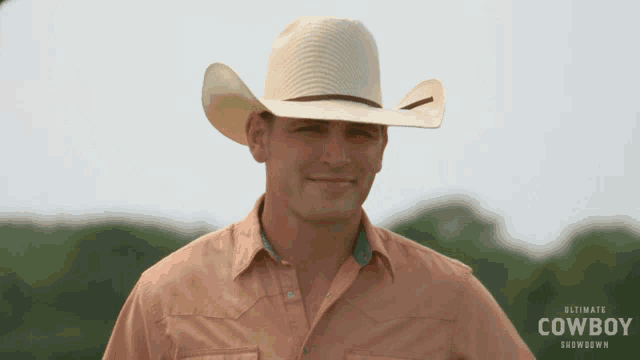 a man wearing a cowboy hat and a shirt that says " ultimate cowboy showdown "
