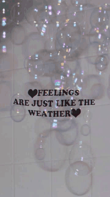 a sign that says feelings are just like the weather surrounded by soap bubbles