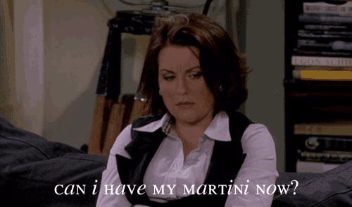a woman sitting on a couch with the words can i have my martini now