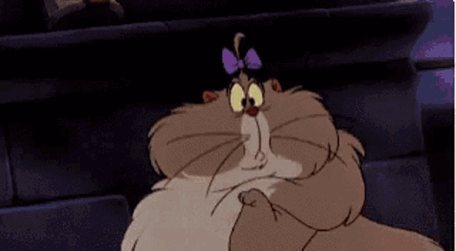 a cartoon cat with a bow on its head