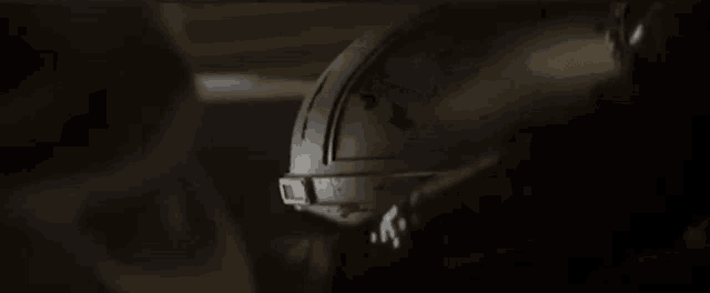 a close up of a person 's helmet in the dark .