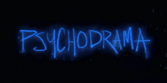 a neon sign that says psychodrama in blue on a black background