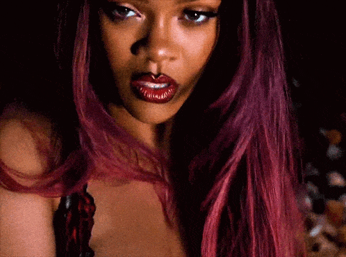 a close up of a woman with red hair
