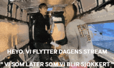 a man and a woman are standing in a van with the words heyo vi flytter dagens stream