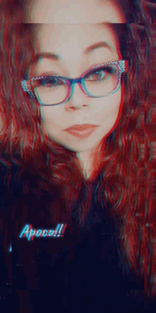 a woman wearing glasses has the word appeared on the bottom left