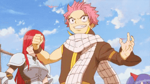 a group of anime characters are standing next to each other and one of them has a scarf around his neck .