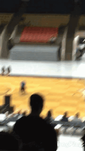a blurry picture of a basketball game with a watermark that says imgpko