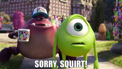 mike and sulley from monsters university are standing next to each other on a sidewalk .