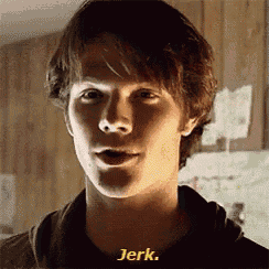 a close up of a young man 's face with the words " jerk " written in yellow
