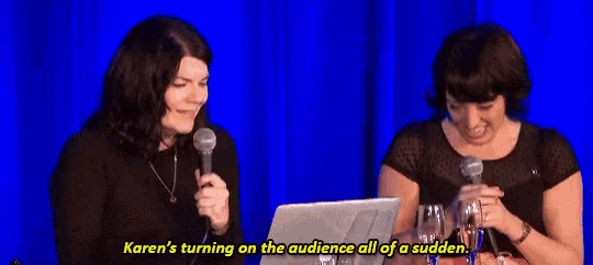 karen is turning on the audience all of a sudden while sitting in front of a laptop