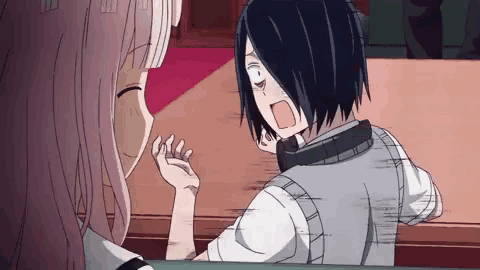 two anime characters are sitting at a table talking to each other