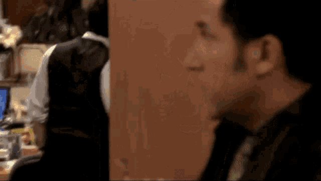 a close up of a man 's face with a blurred background