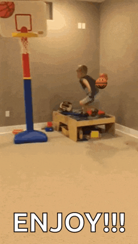 a boy is jumping in the air with a basketball in front of a basketball hoop with the words enjoy !!! below him .