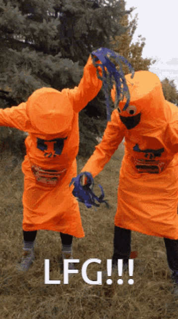 two people in orange costumes with the word lfg on the bottom right