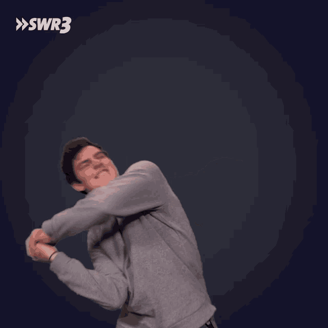 a blurry picture of a man with the letters swr3 on the bottom right