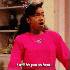 a girl in a pink shirt is saying i will hit you so hard