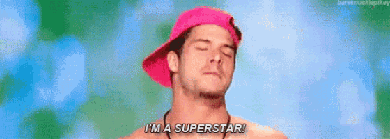 a shirtless man wearing a pink hat is saying `` i 'm a superstar ! ''