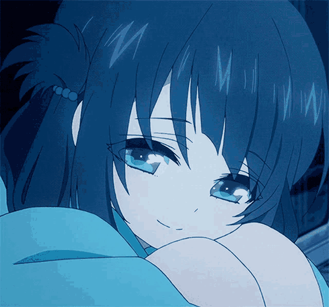 a close up of a girl with blue hair