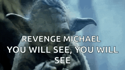 a picture of a statue of yoda with the words `` revenge michael you will see , you will see '' written on it .