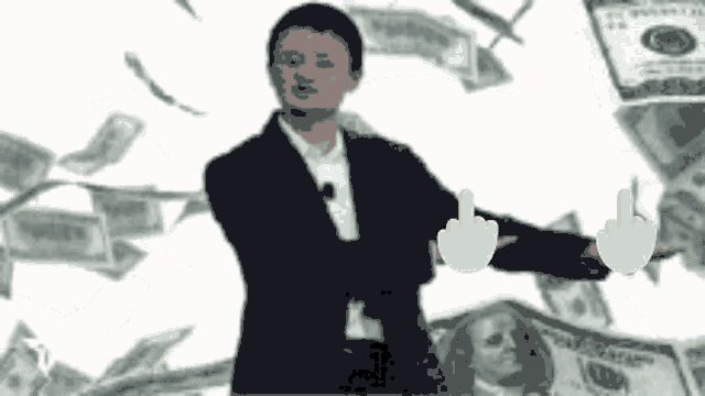a man in a suit is giving the middle finger