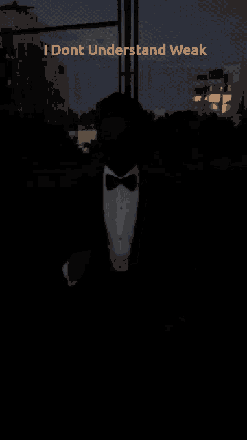 a man in a tuxedo is standing in the dark with the words i dont understand weak written below him