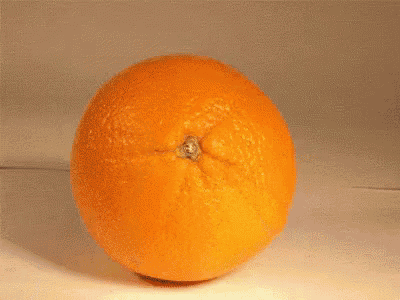 a peeled orange sits next to a peeled orange