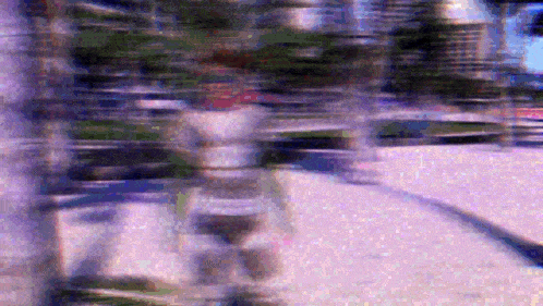 a blurry image of a person walking down a street