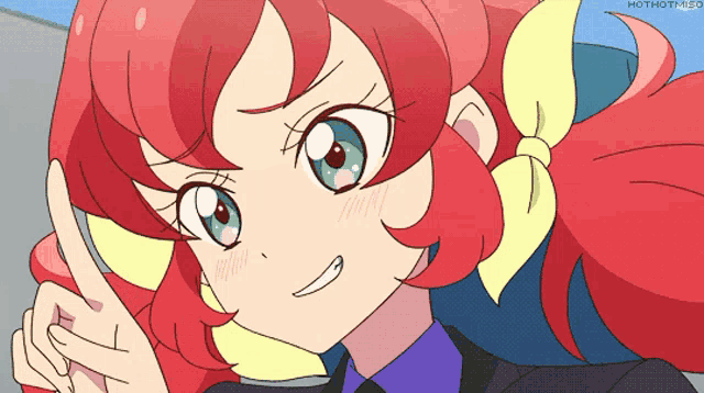 a girl with red hair and green eyes is smiling
